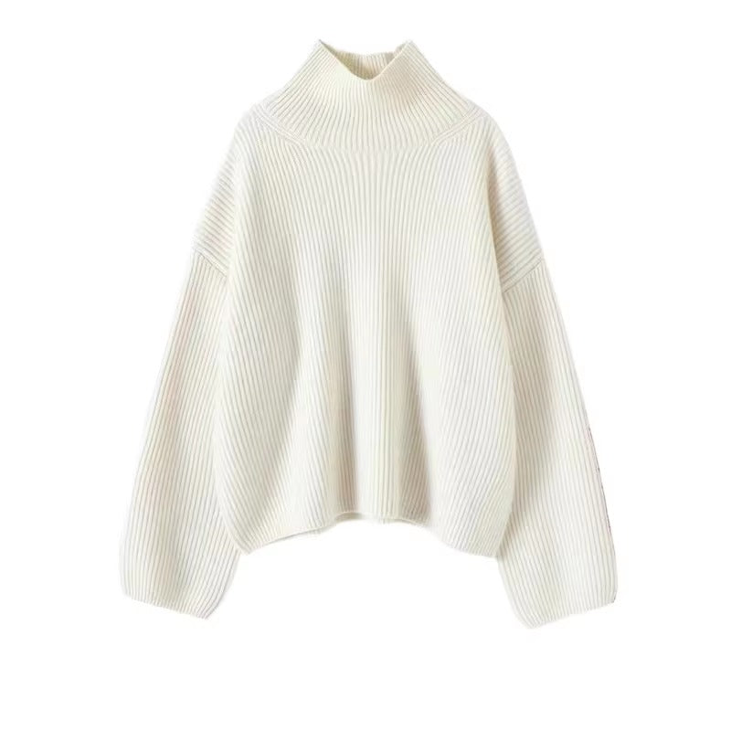 Ivory oversized knit pullover with a crew neckline and relaxed sleeves, front view.
