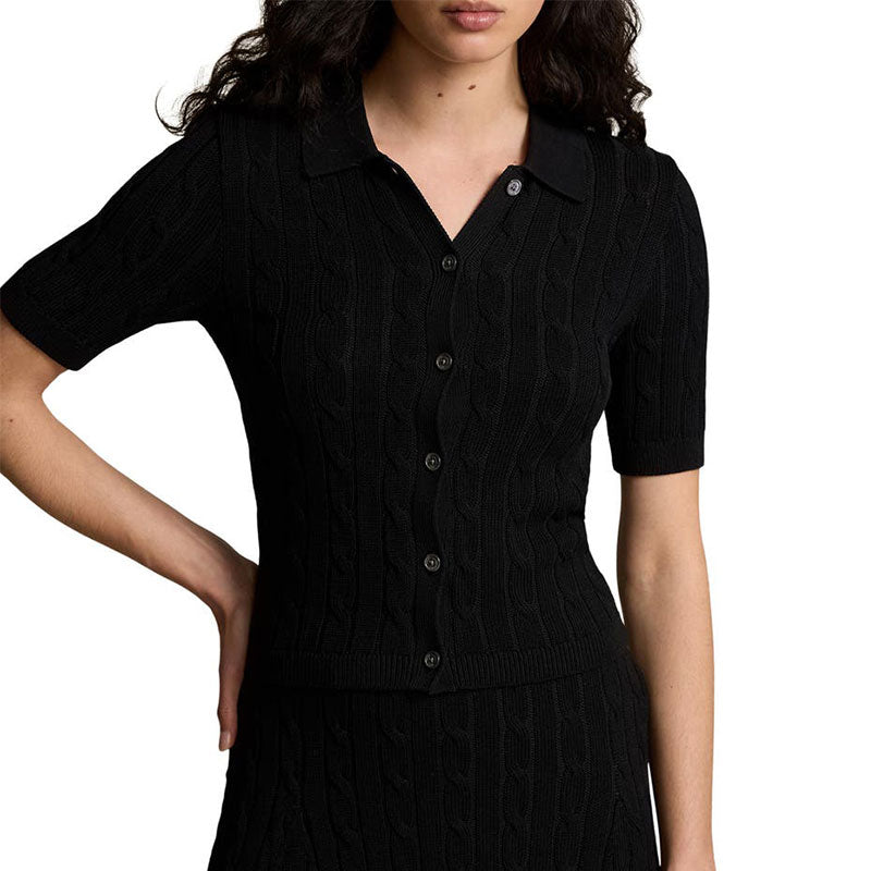 Model wearing black short-sleeve cable knit polo sweater with a collared neckline.