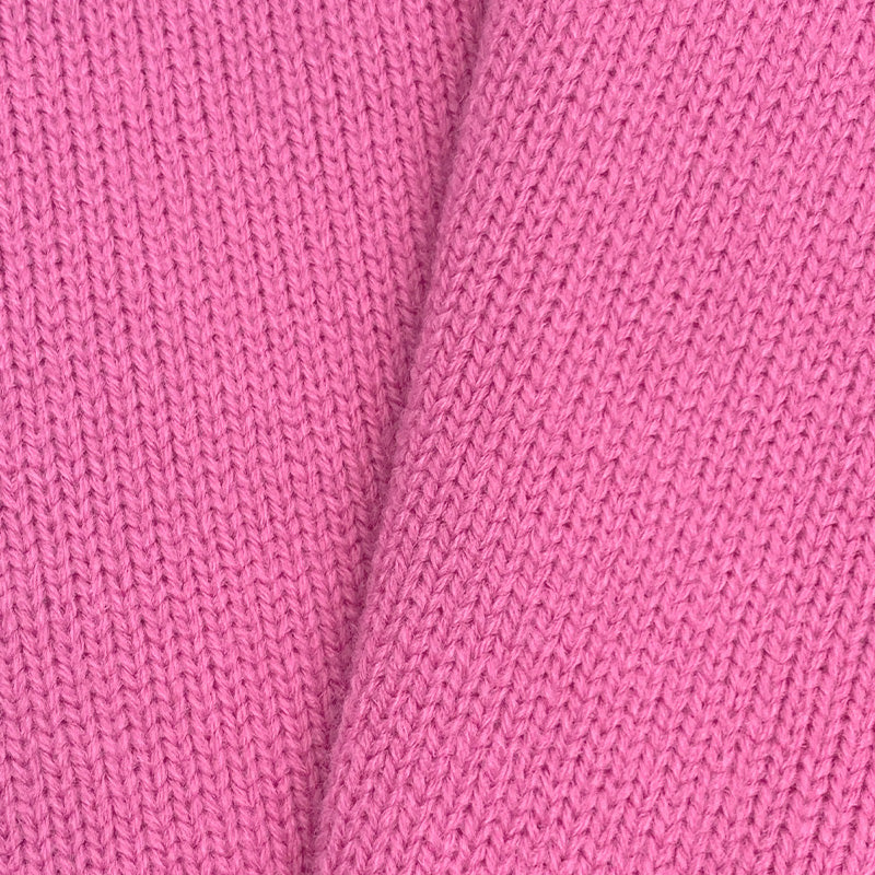 Close-up of soft pink knit fabric texture – soft material for custom cardigans