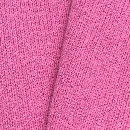 Close-up of soft pink knit fabric texture – soft material for custom cardigans
