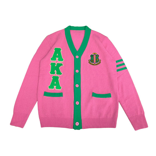 Custom Alpha Kappa Alpha cardigan in fuchsia and green, featuring bold AKA letters and embroidered sorority crest, ideal for Greek life apparel and group orders