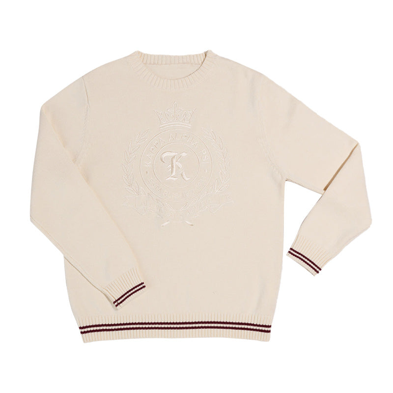 Custom Greek sweater in cream with cream embroidered 'Kappa Alpha Psi' Logo, laid flat.