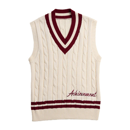 Cream cable knit vest with maroon trim and "Achievement" embroidery