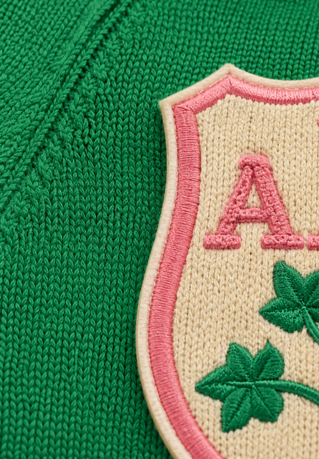 Closeup: shield embroidered patch with letter A & clover