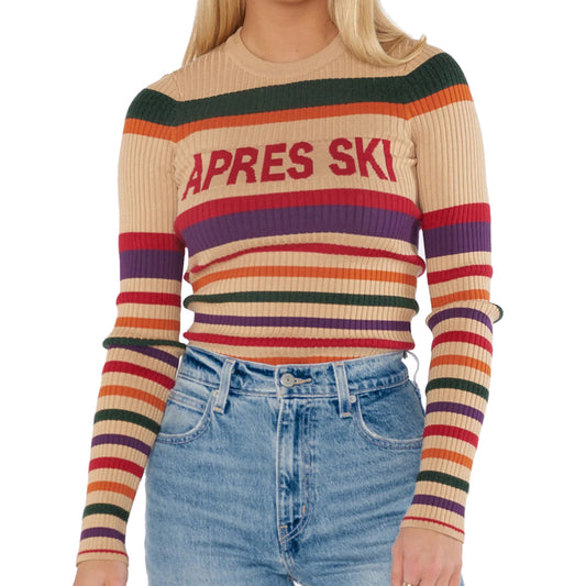 Front view of beige ribbed sweater with horizontal multicolor stripes and red text design on chest.