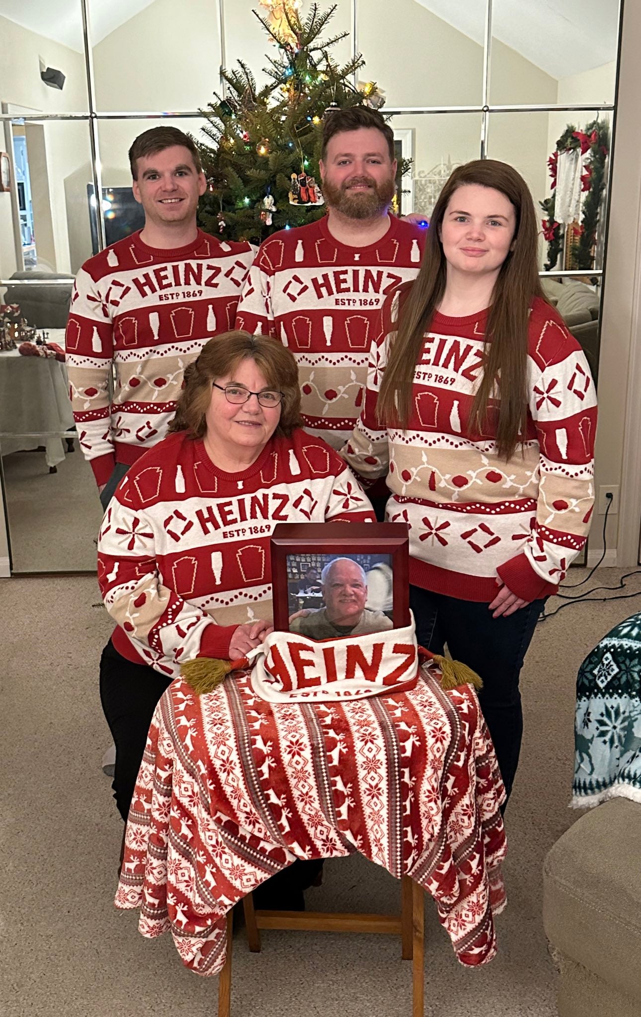 Group photo of customers wearing custom Christmas sweaters for holiday gifts, showcasing festive and branded designs