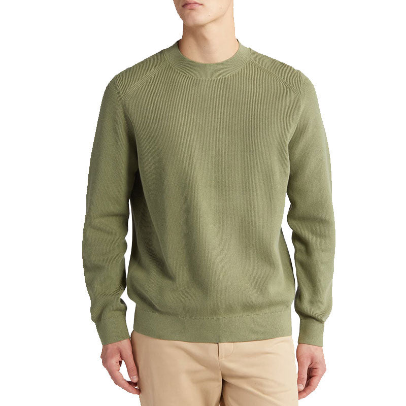 Front view of a man wearing a custom 100% cotton knit sweater in olive green, featuring a solid crew neck design and long sleeves.