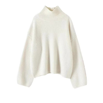 Ivory oversized knit pullover with a crew neckline and relaxed sleeves, front view.