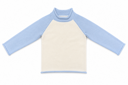 Kids' ivory knit pullover with light blue raglan sleeves, front view.