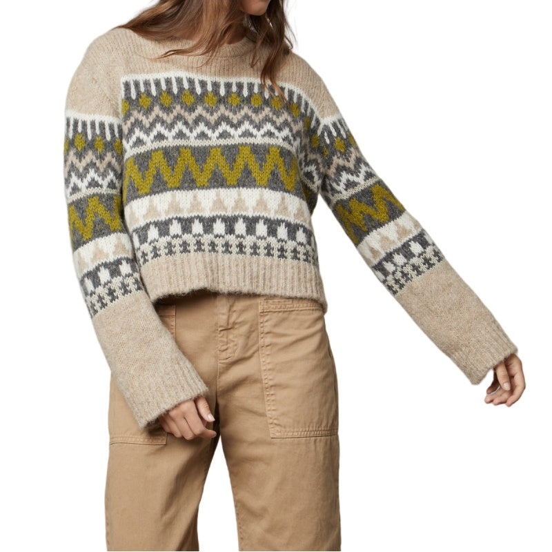 Woman wearing a custom cashmere blend crew neck long sleeve knitted sweater in beige with patterned design