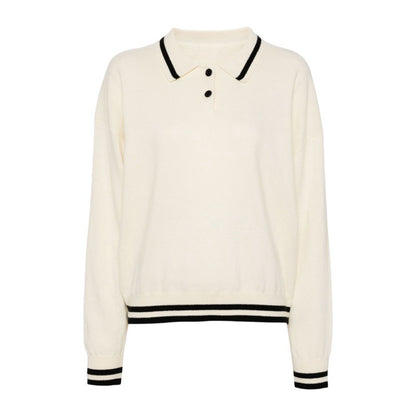 Custom wool blend knit polo sweater in off-white with black collar and hem accents, featuring two buttons at the neckline.