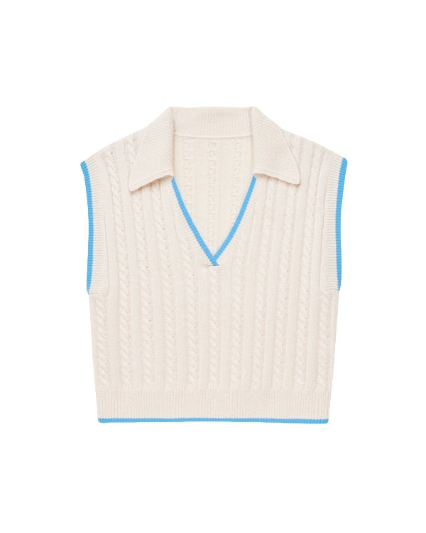 Sleeveless custom cashmere polo sweater tank top in cream with blue V-neck and armhole trim, featuring a cable knit pattern.