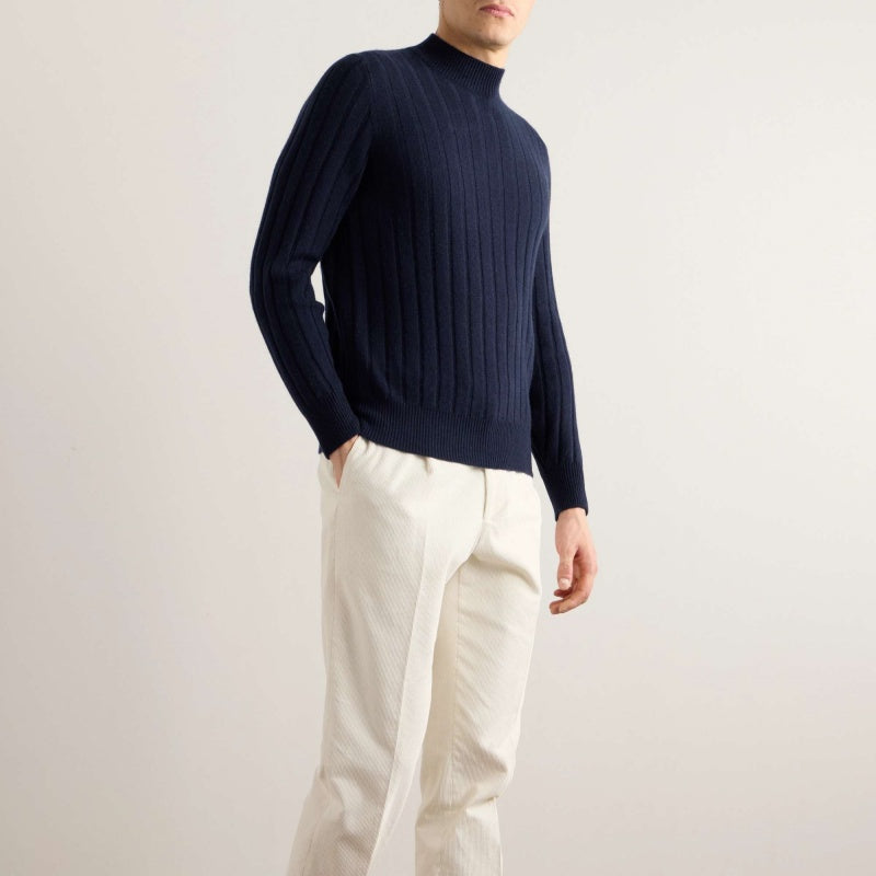 Side view of a man wearing a dark navy crew neck cashmere sweater, perfect for wholesale and customization.