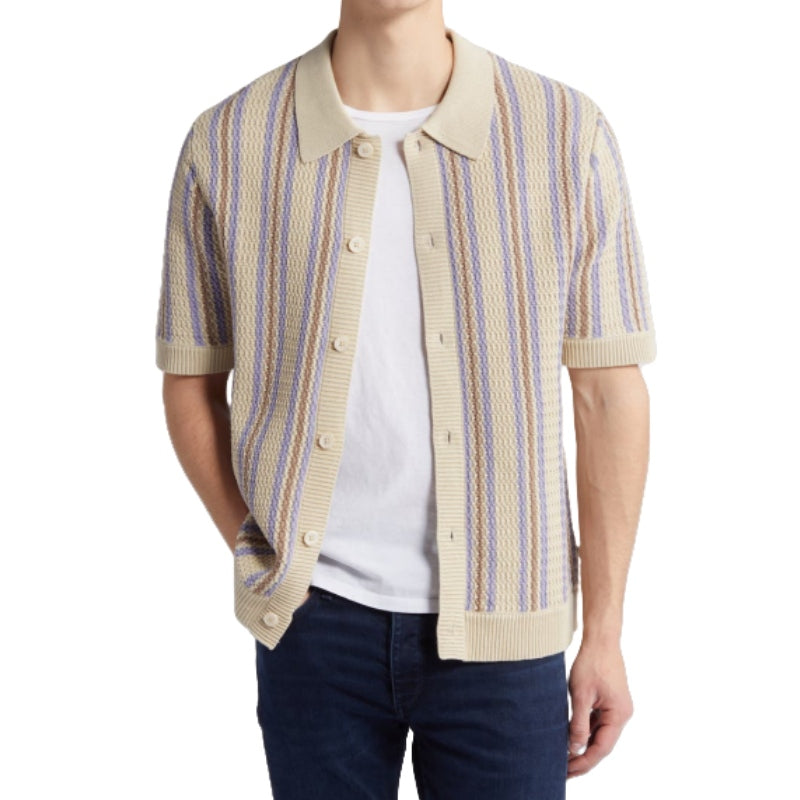 Man modeling Custom Linen Knit Polo with beige and blue stripes, paired with jeans - Men's Short Sleeve Knitwear