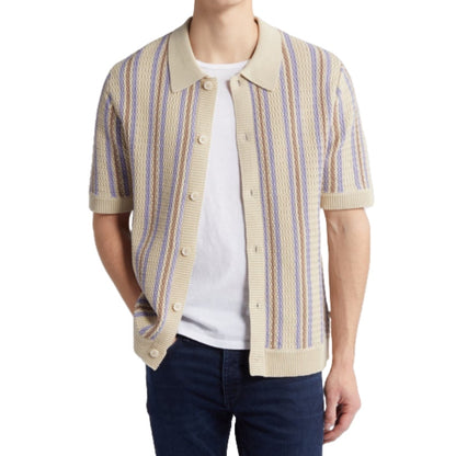 Man modeling Custom Linen Knit Polo with beige and blue stripes, paired with jeans - Men's Short Sleeve Knitwear