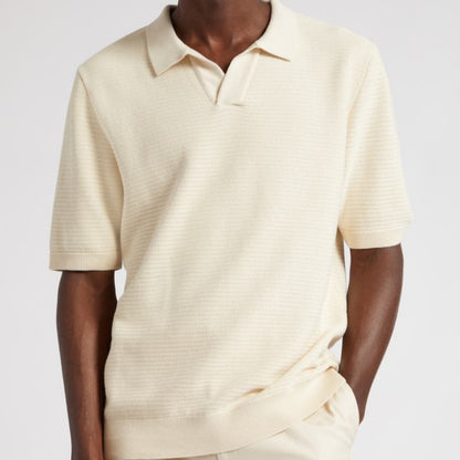 Man modeling a custom plain knit short sleeve polo shirt with polo collar in cream