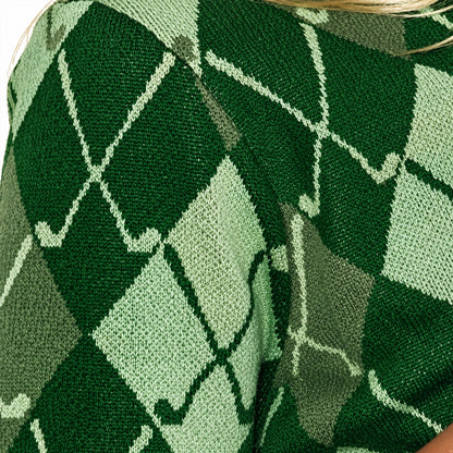 Close-up of the green and cream argyle pattern on knitted fabric