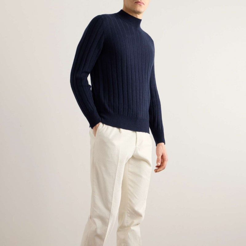 Side view of a man wearing a dark navy crew neck cotton sweater, perfect for wholesale and customization.
