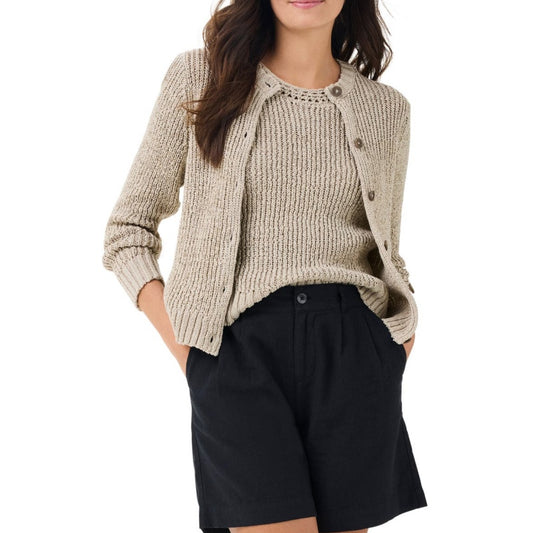 The sweater features a textured knit pattern, providing both visual interest and a cozy feel. It is paired with black high-waisted shorts, creating a casual yet polished look. The sweater's design includes a crew neck and long sleeves, making it a versatile piece for layering in various seasons.