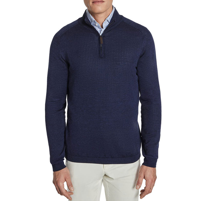 Front view of a man wearing a custom 100% cotton knit sweater in navy blue with a solid 1/4 zipper polo collar design.