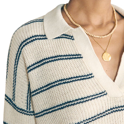 Close-up front view of a custom wholesale cotton blend striped V-neck pullover sweater in beige with a gold necklace