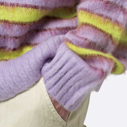 Close-up of sleeve detail on custom striped mohair knit sweater