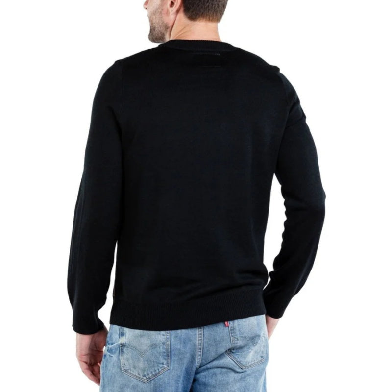 Back view of a custom black knit sweater with a simple design, highlighting the solid color and clean finish.