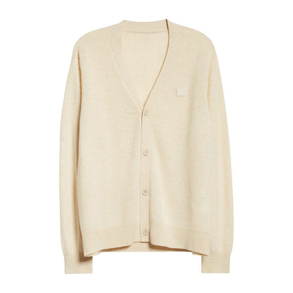 Beige V-neck cardigan sweater laid flat - 100% cotton custom knitwear.