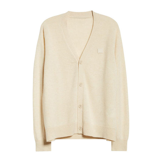 Beige V-neck cardigan sweater laid flat - 100% cotton custom knitwear.