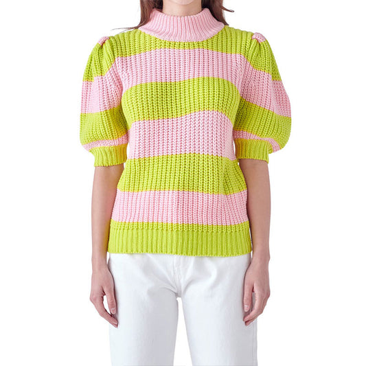 Front view of a model wearing a custom colorful striped two-tone knitwear top in pink and green, with a high collar and puff sleeves.