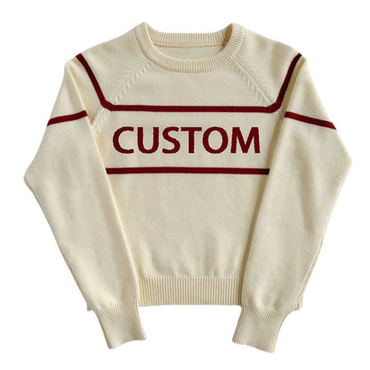 White knit pullover sweater with red horizontal stripes and the word 'CUSTOM' in red across the chest.