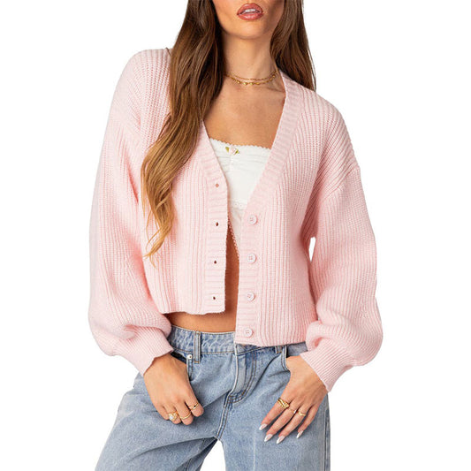 Front view of a custom V-neck button-up pink knit cardigan with a cropped design, ideal for women's casual fashion.