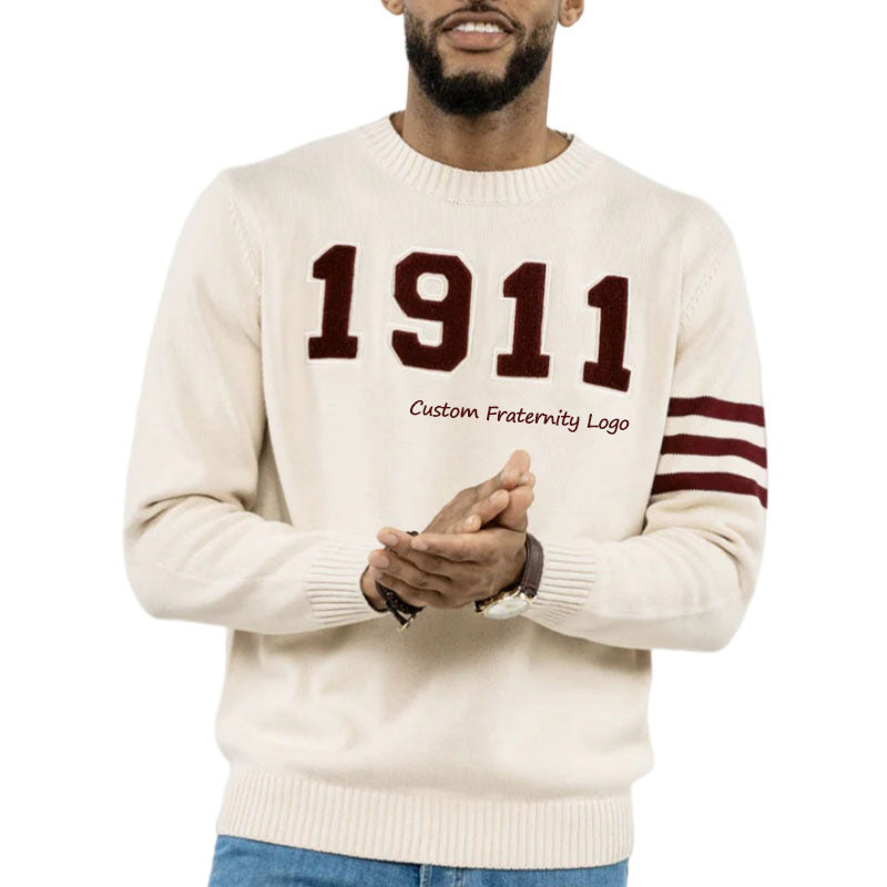 Custom cream-colored fraternity sweater with bold 1911 logo and striped sleeves. Greek sweater available for bulk orders