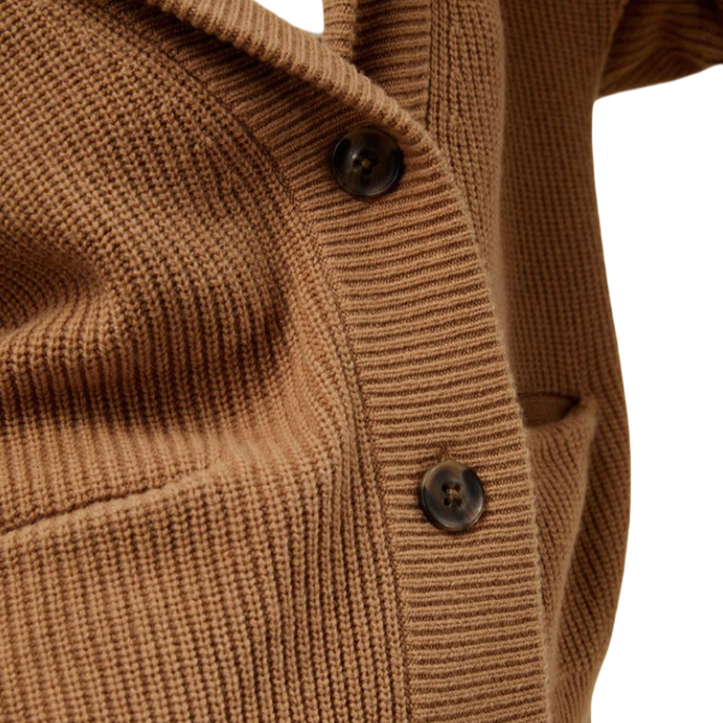 Close-up view of the brown wool fabric and button details on an oversized cardigan.