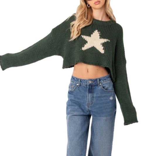 Front view of a custom dark green crop knit sweater featuring a white star jacquard design on the front. The sweater is styled with high-waisted jeans, showcasing its trendy cropped fit and relaxed, casual look.