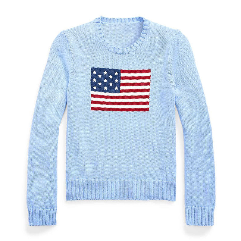 Front view of a light blue knit sweater with an American flag pattern on the chest. The sweater has a crewneck, long sleeves, and ribbed cuffs and hem.