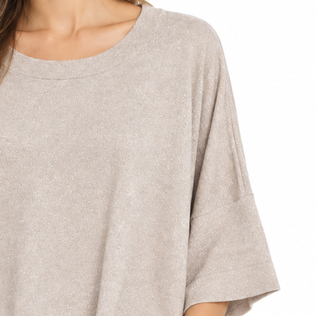 Close-up of the wide short sleeve and fine knit texture on a women's pullover