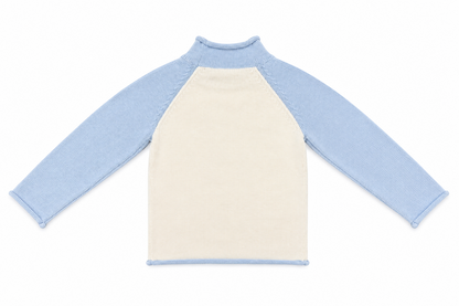 Back view of a kids' knit pullover with blue raglan sleeves and an ivory body.