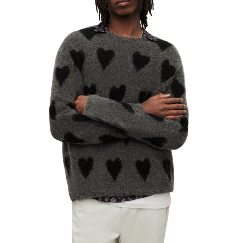 Model wearing a custom gray mohair sweater with black heart patterns