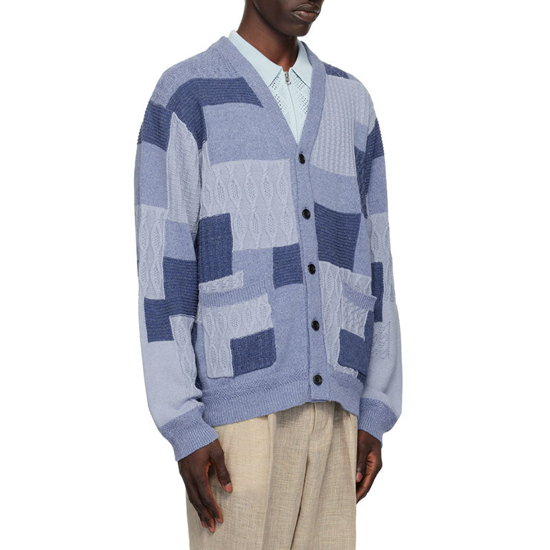 Side view of custom blue patchwork wool blend men's cardigan sweater with ribbed cuffs and hem