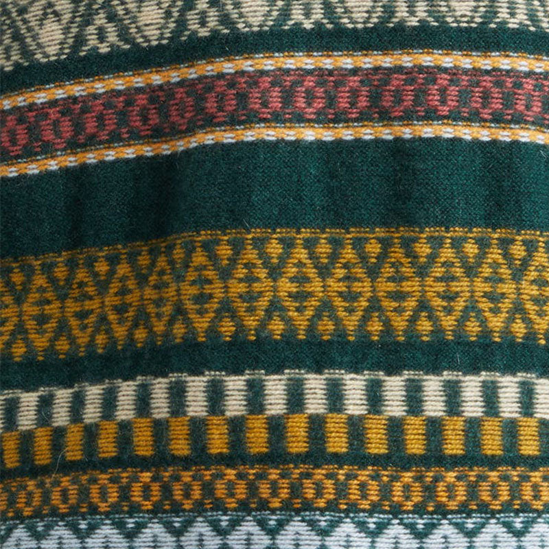 Close-up of the detailed embroidery on a custom cotton blend knit sweater