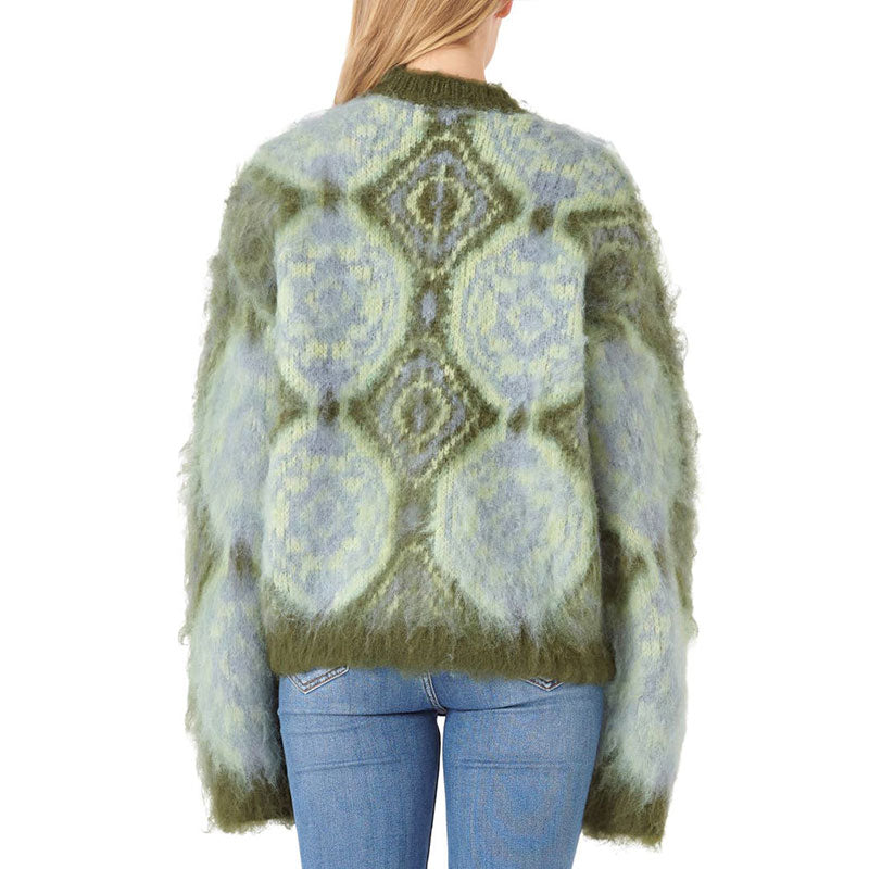 Back view of a woman in a geometric knit sweater highlighting the detailed design and comfortable fit.