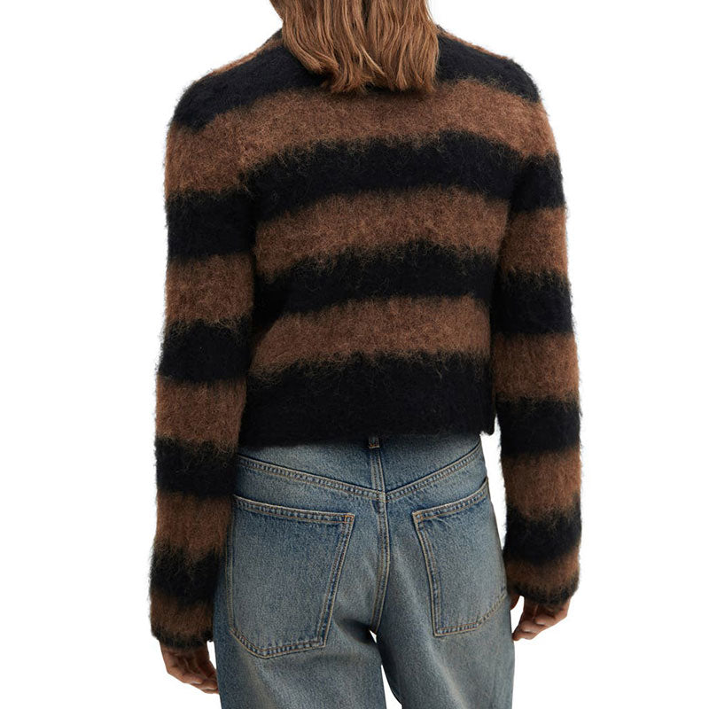 The back view of a person wearing a fuzzy sweater with wide, horizontal black and brown stripes. The person has shoulder-length brown hair and is also wearing blue jeans with visible back pockets.