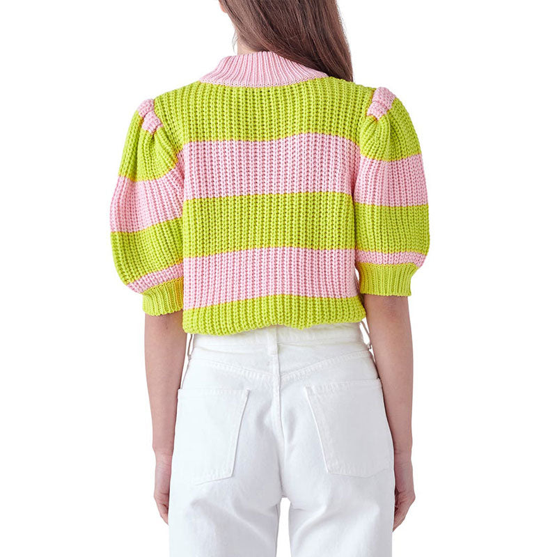 Back view of a model wearing a custom colorful striped two-tone knitwear top in pink and green.