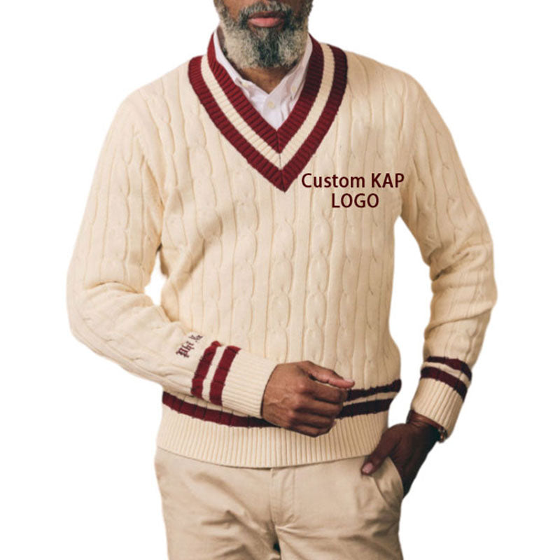 Man wearing cream cable knit sweater with maroon trim and "Custom KAP LOGO" embroidery