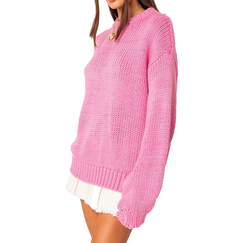 Side view of a woman in a pink knit sweater showcasing the relaxed fit and texture of the material.