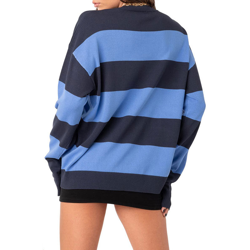 Back view of a blue and navy striped oversized pullover sweater.