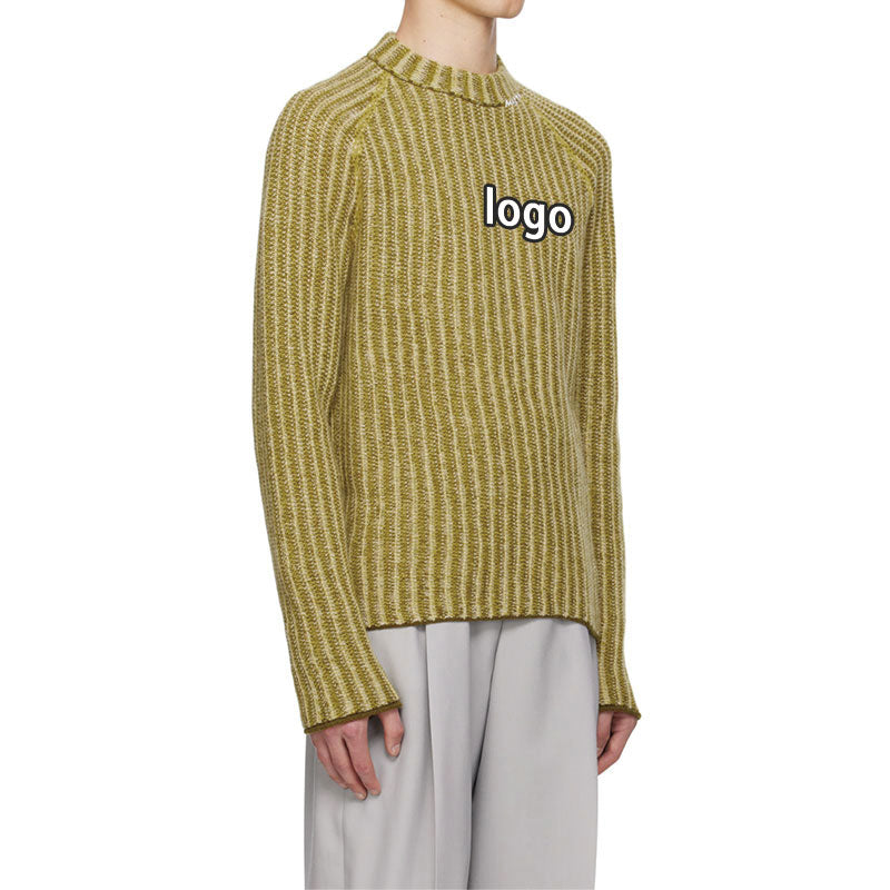 Side view of a yellow-green striped knit sweater with a custom logo on the chest, worn by a model.