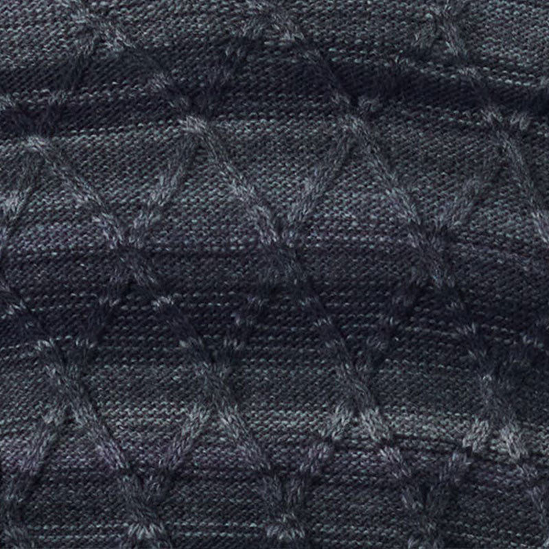 Close-up image of a dark wool blend knit sweater, highlighting the detailed textured diamond pattern.