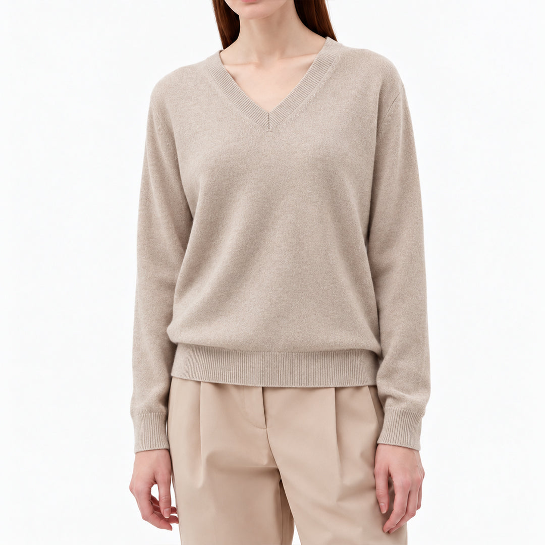 Beige women's V-neck pullover with ribbed cuffs